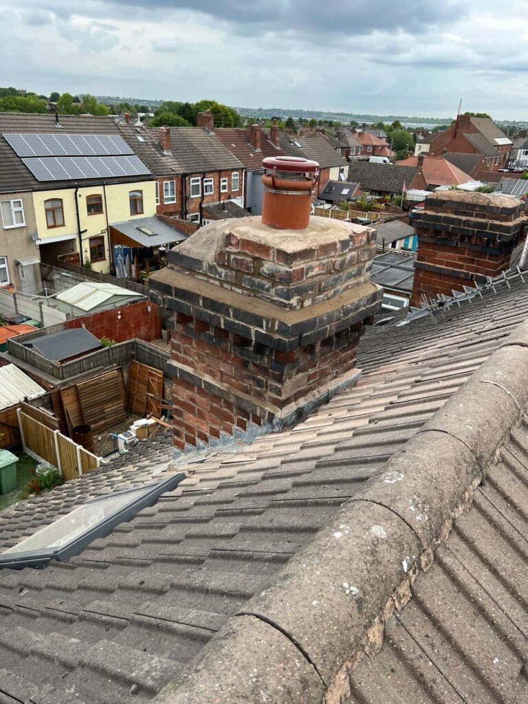 This is a photo taken from a roof which is being repaired by Caterham Roofing Repairs, it shows a street of houses, and their roofs