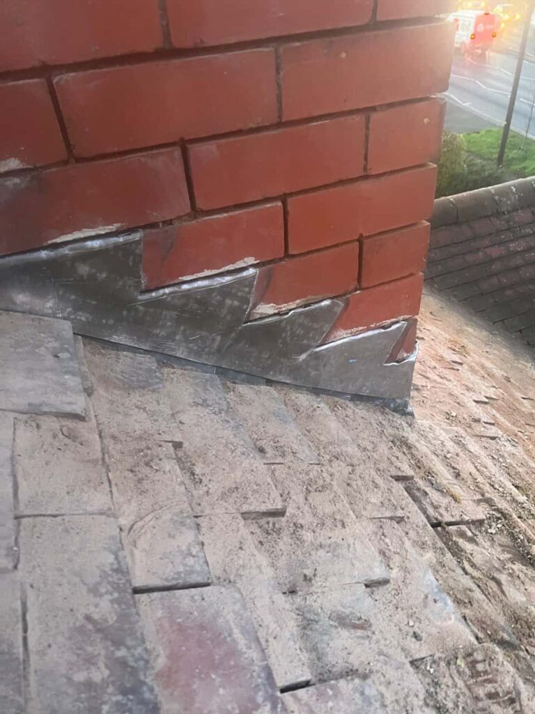This is a photo of new leadwork being installed around an old chimney. Works carried out by Caterham Roofing Repairs